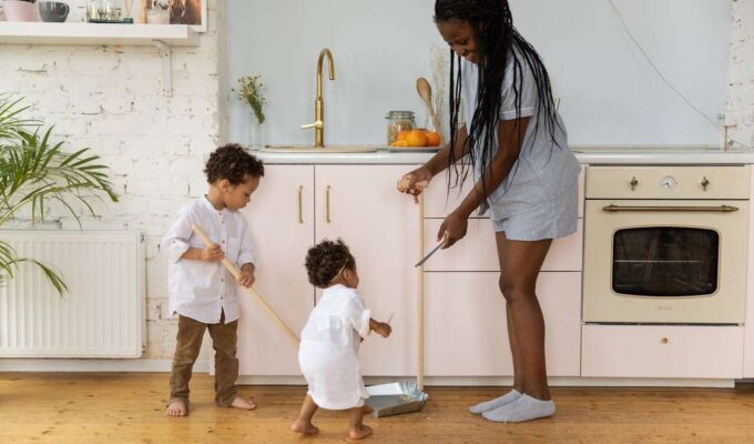Busy Family Tackles Quick Cleaning Together in a Cozy Kitchen