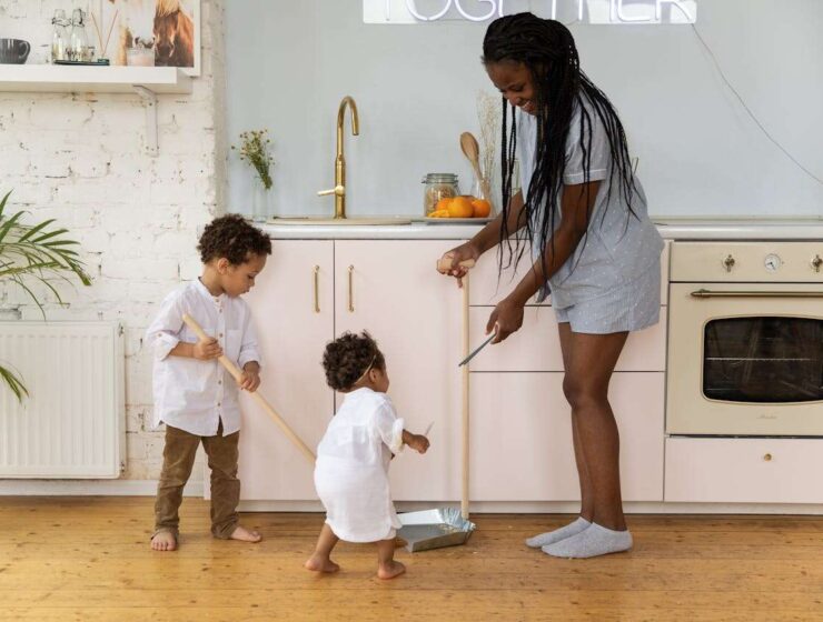 Busy Family Tackles Quick Cleaning Together in a Cozy Kitchen