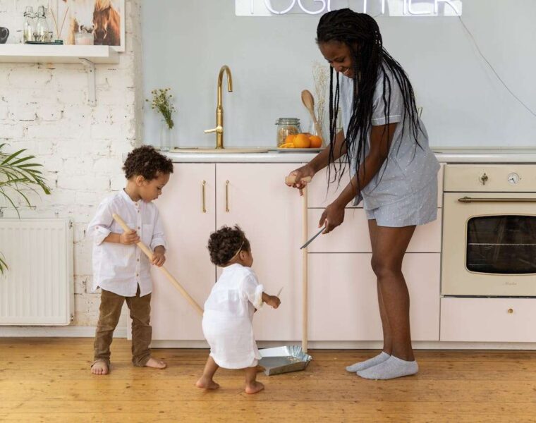 Busy Family Tackles Quick Cleaning Together in a Cozy Kitchen